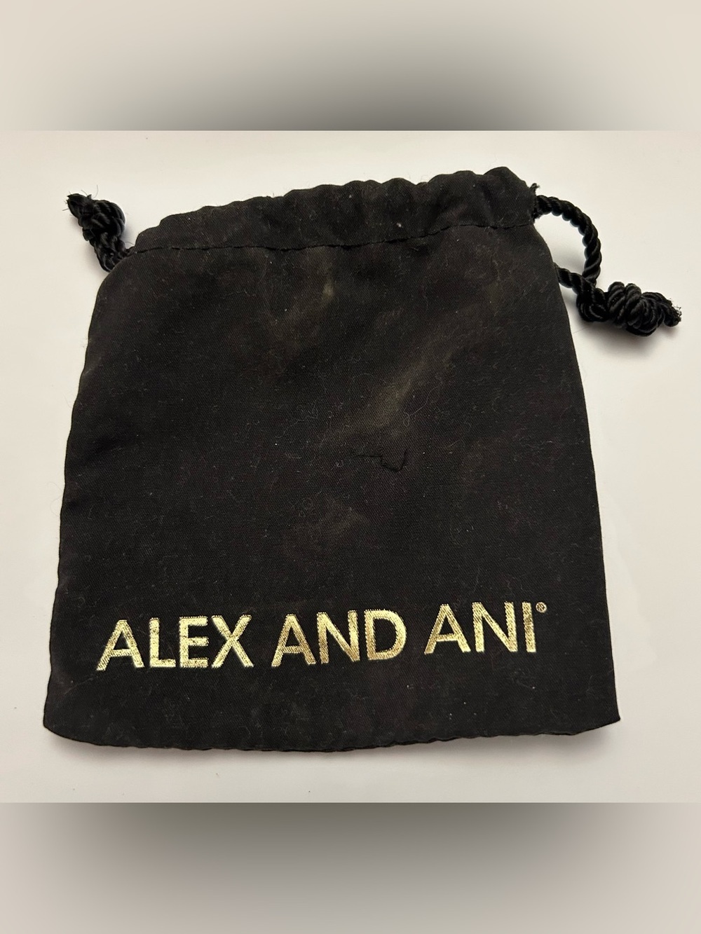 Alex and Ani Black and Gold Logo Drawstring Pouch